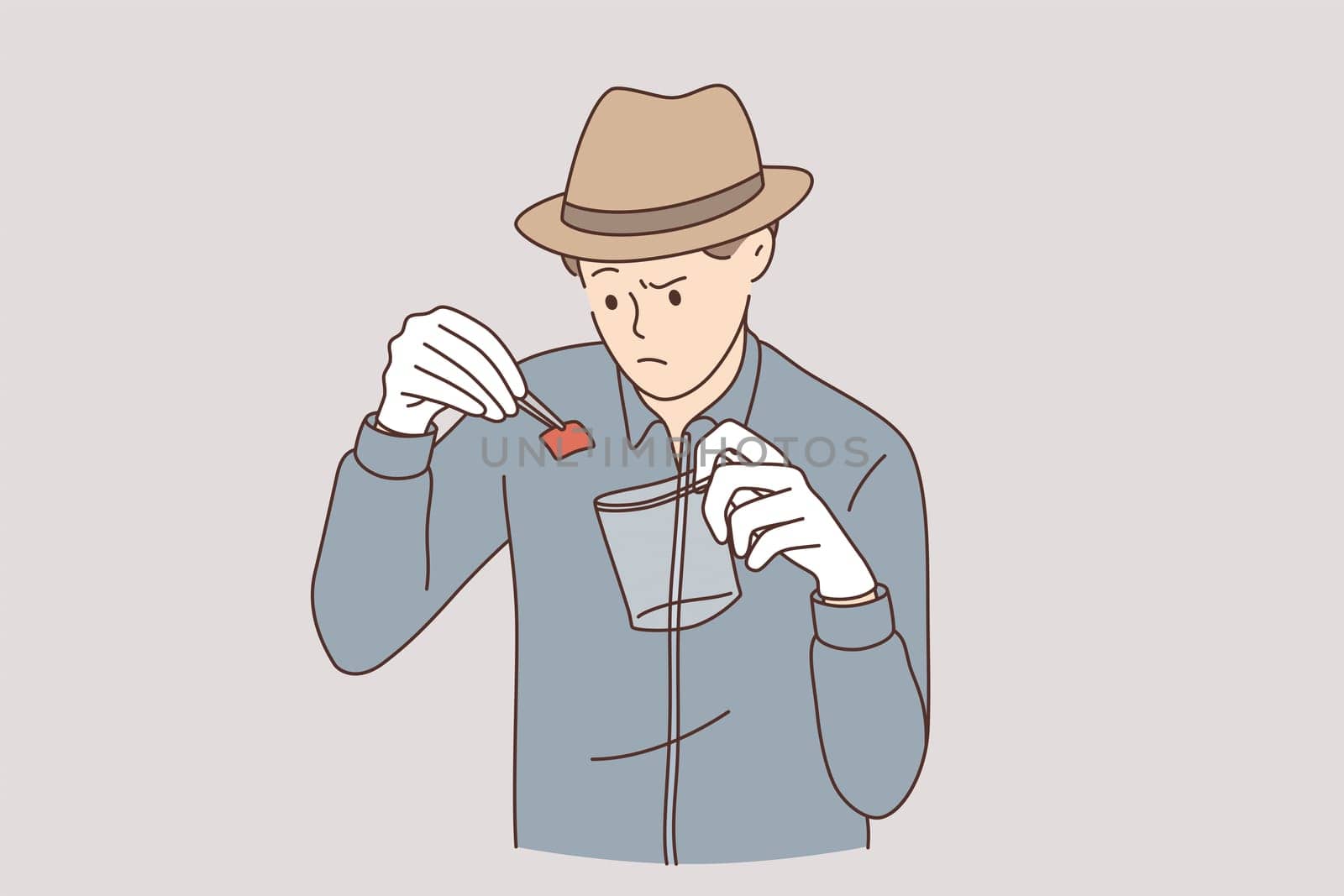 Detective with evidence working concept. Young serious an working as detective in hat putting piece of paper evidence of crime to special transparent bag