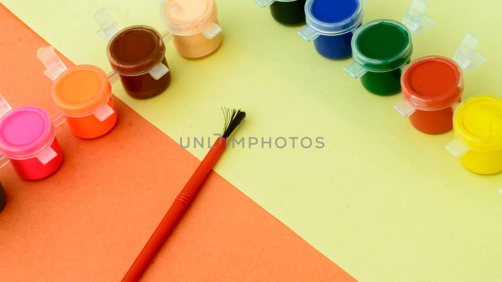 Colors art background. Watercolor paints and paintbrush. knolling concept.