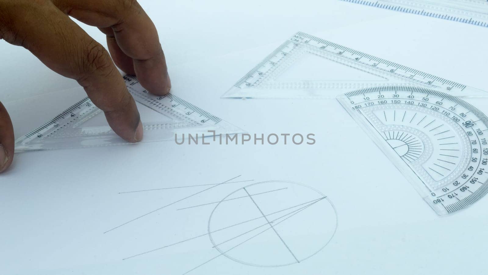 Design Professional using drawing tools close up