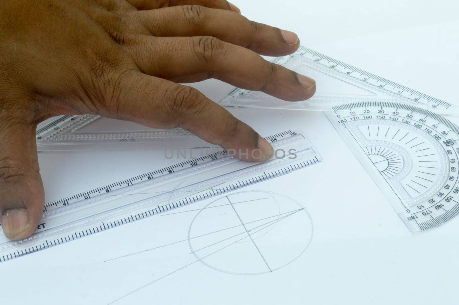 Design Professional using drawing tools close up