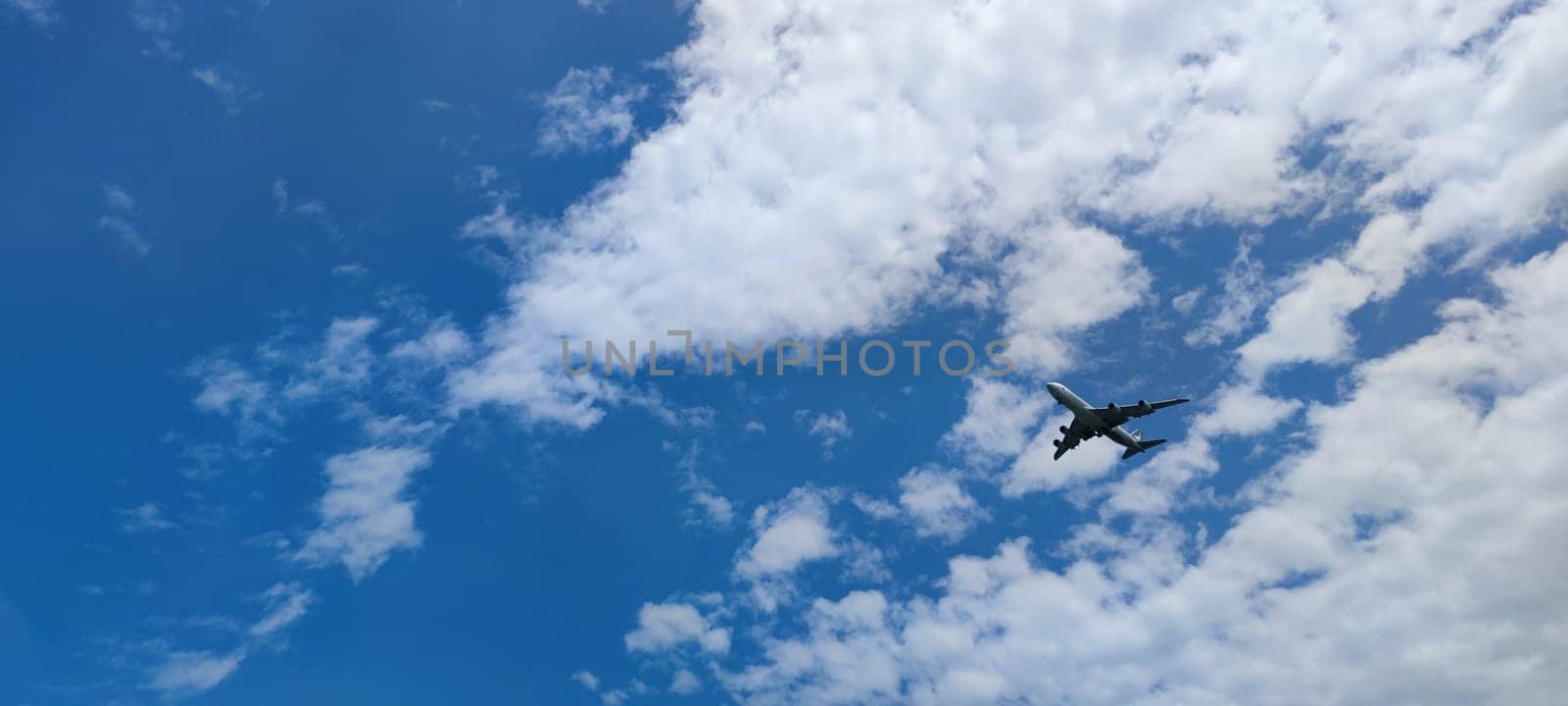 The Airplane in the sky at sunrise or sunset