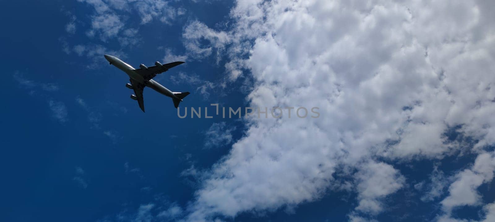 The Airplane in the sky at sunrise or sunset