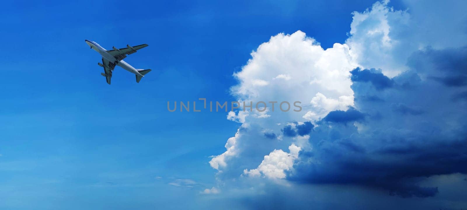 The Airplane in the sky at sunrise or sunset