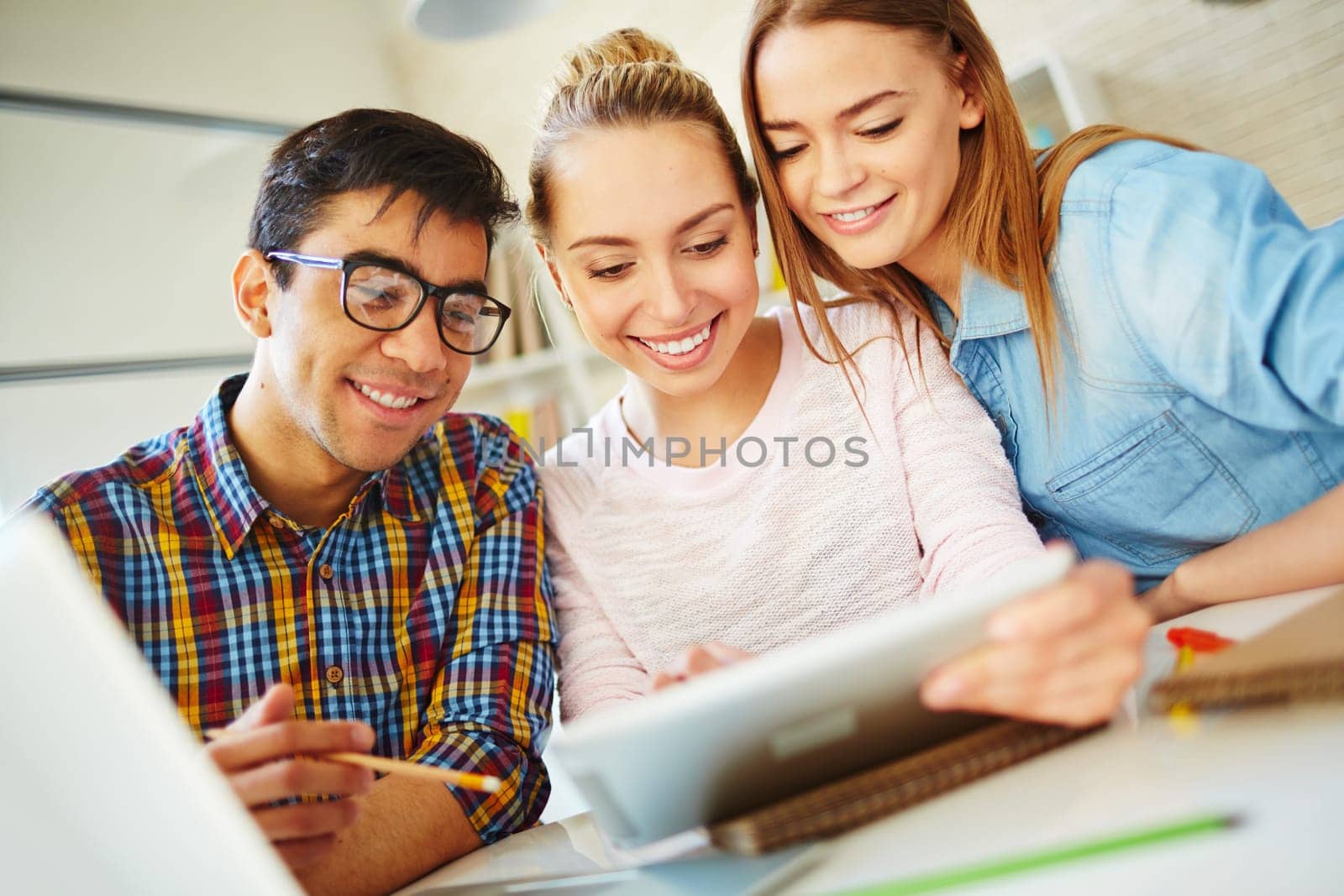 Clever teenagers using touchpad for networking