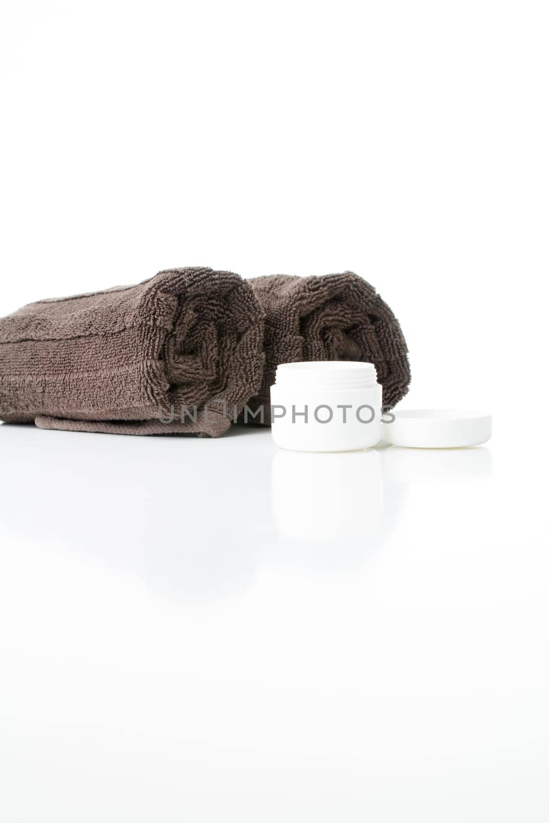Open cream tin and towels