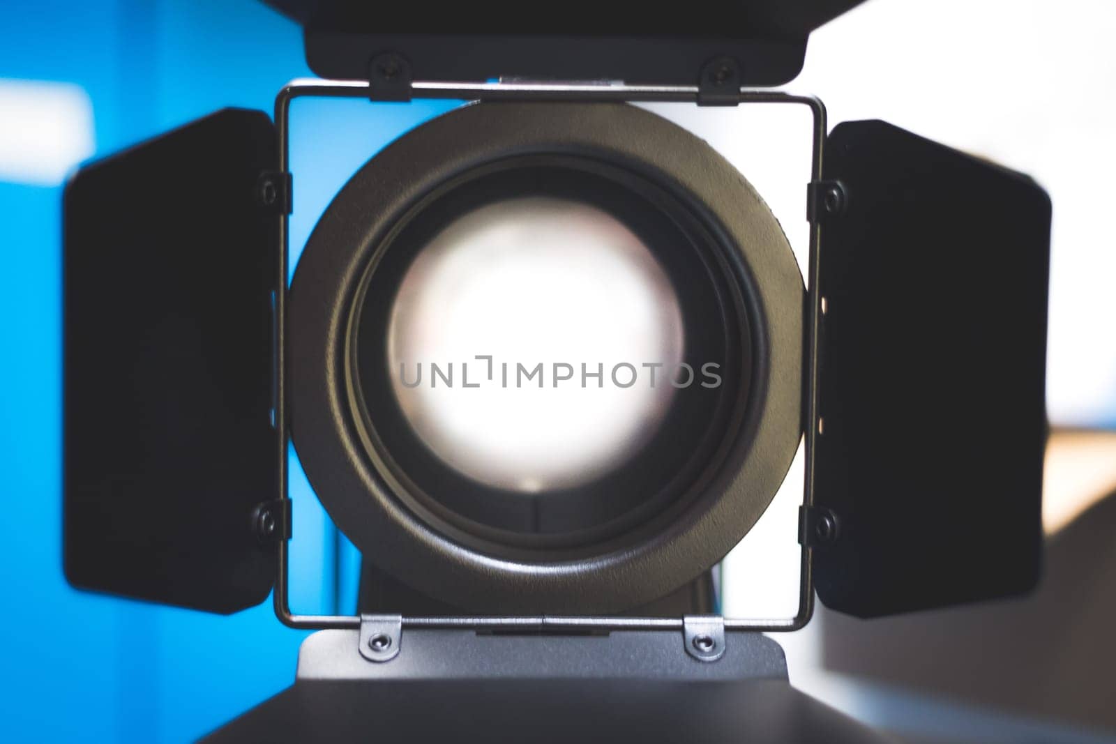 Professional studio spotlight in a TV studio. Lighting equipment for photography or videography.
