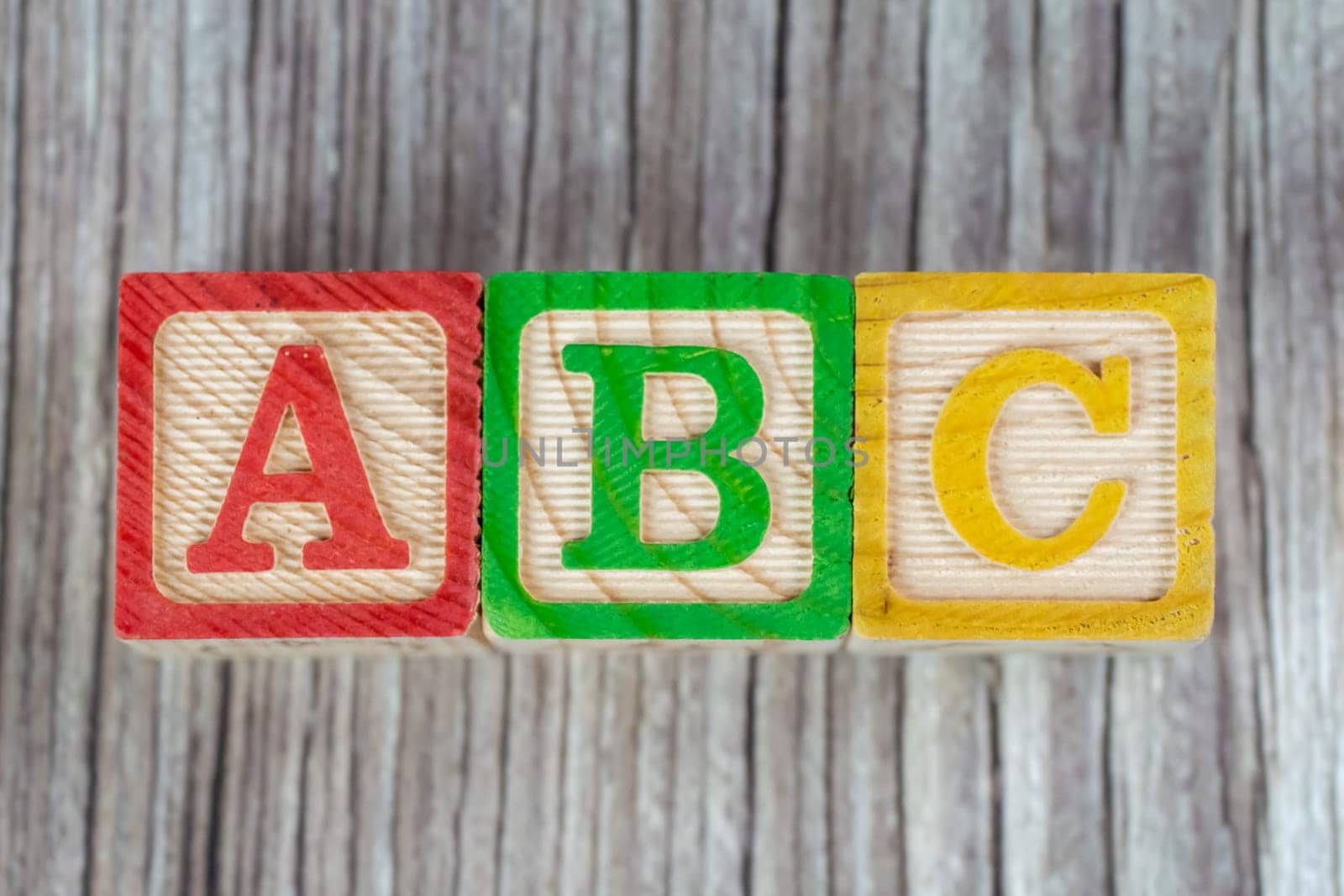 ABC wood block on wooden surface. Child education concept