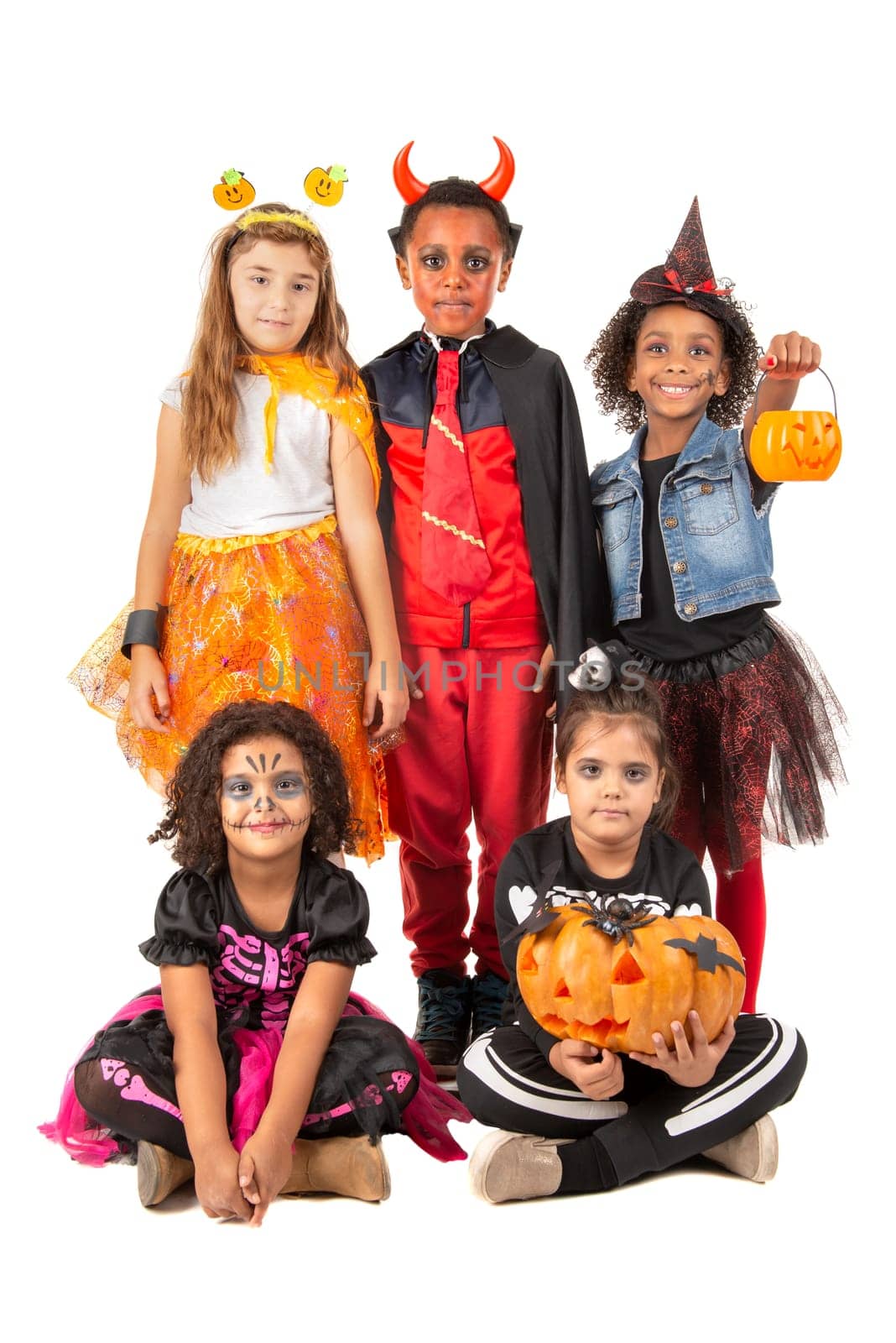 Group of kids in Halloween/Carnaval costumes isolated