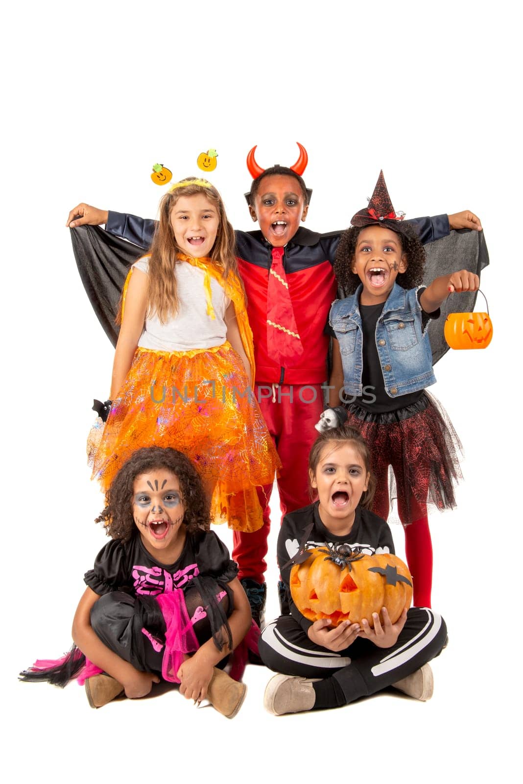 Group of kids in Halloween/Carnaval costumes isolated