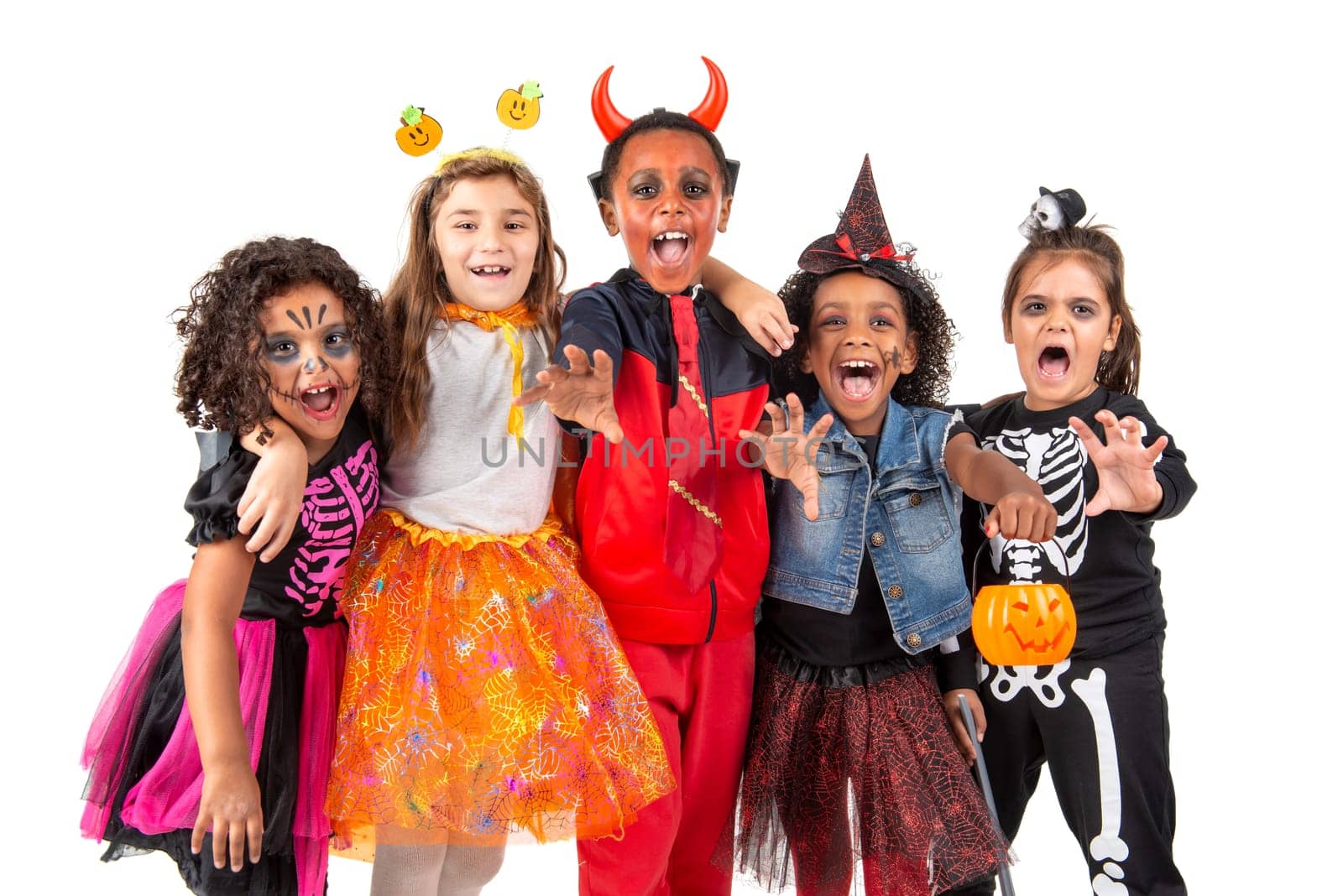 Group of kids in Halloween/Carnaval costumes isolated