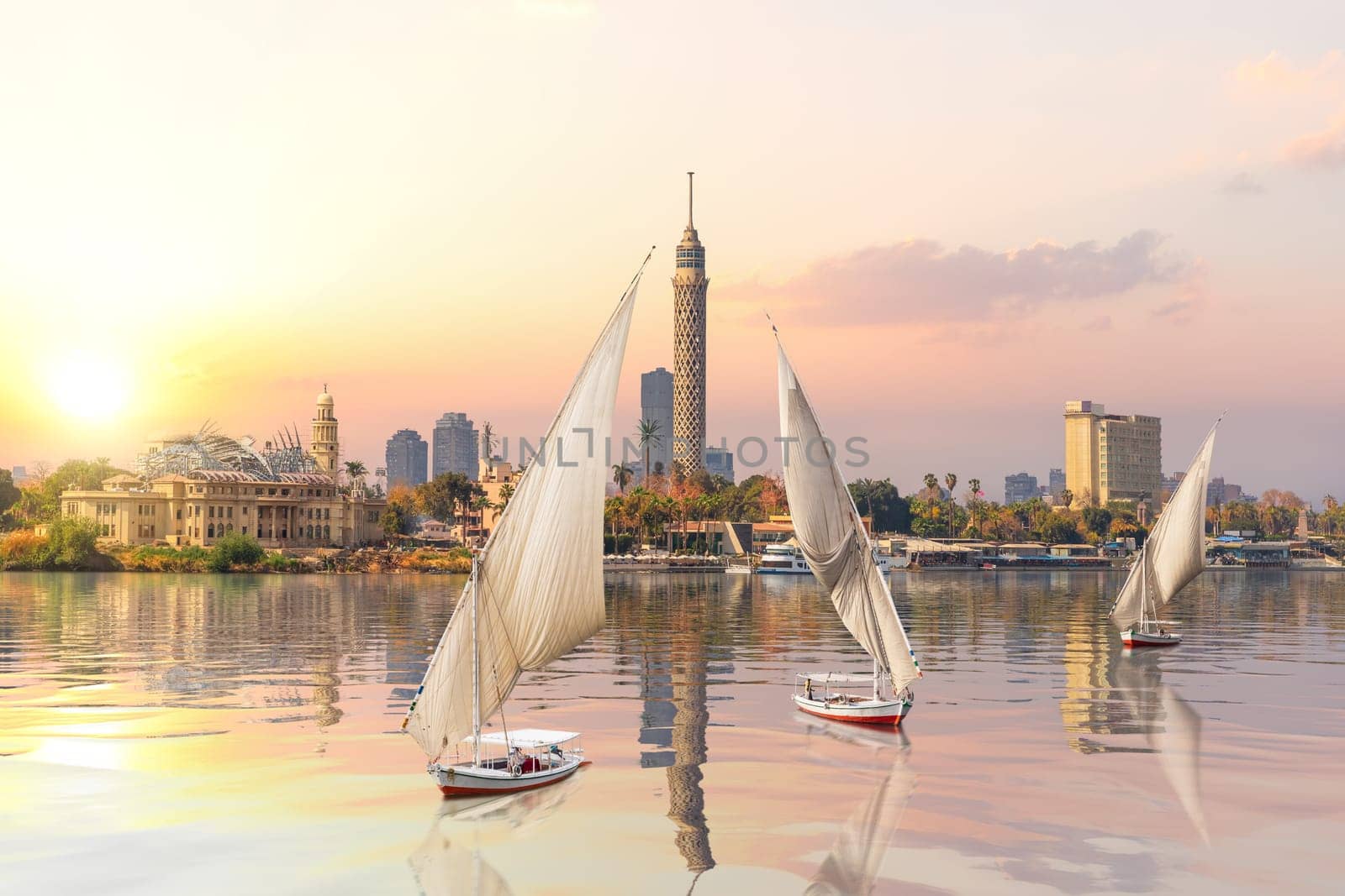 Sunset on the Nile and sailboats, Cairo, Egypt.