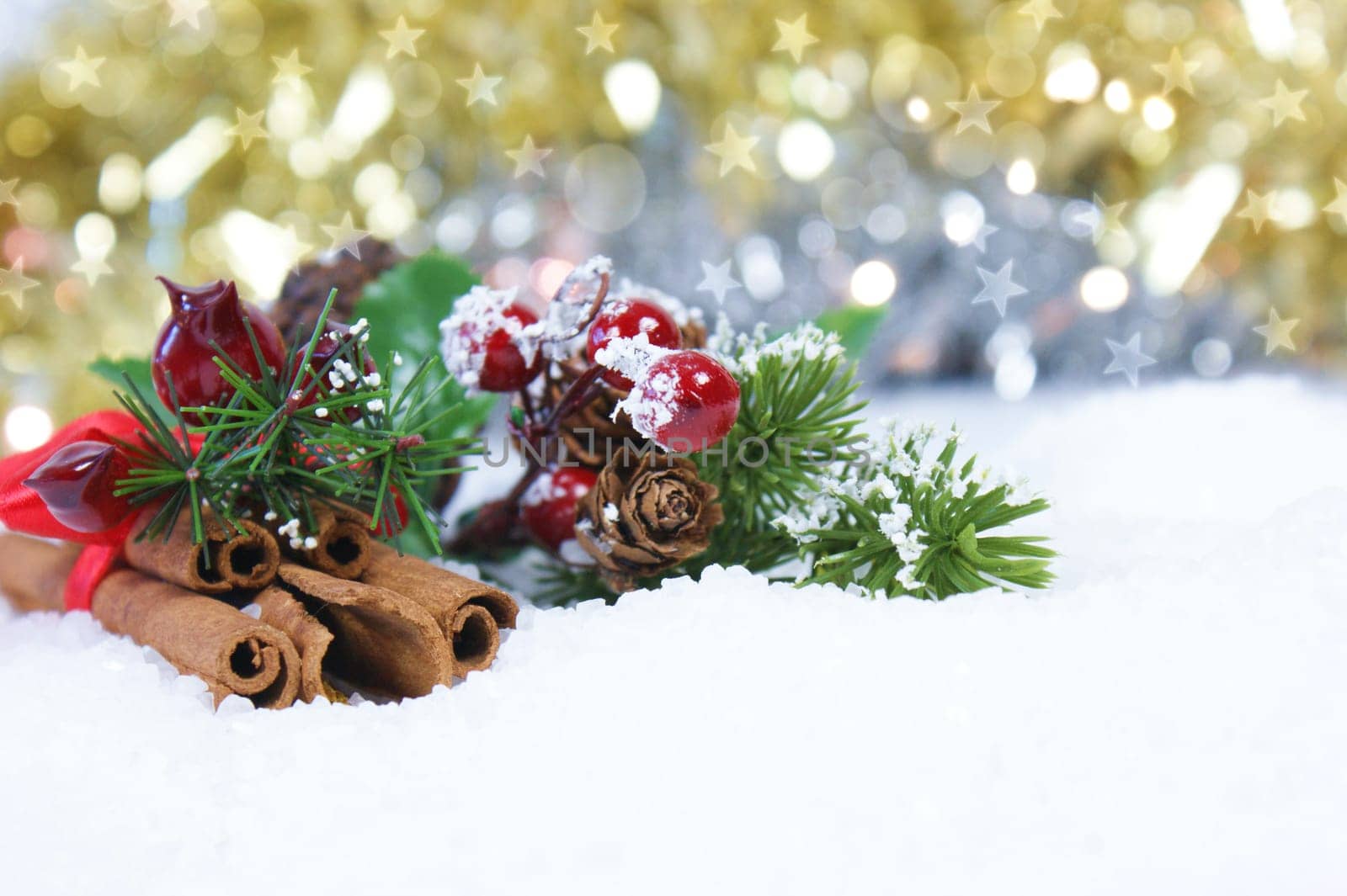 Christmas cinnamon and decorations in snow