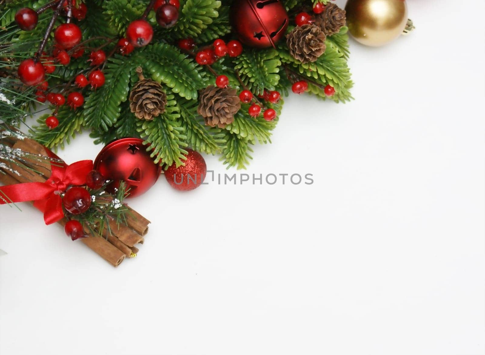 Christmas cinammon and decorations on white