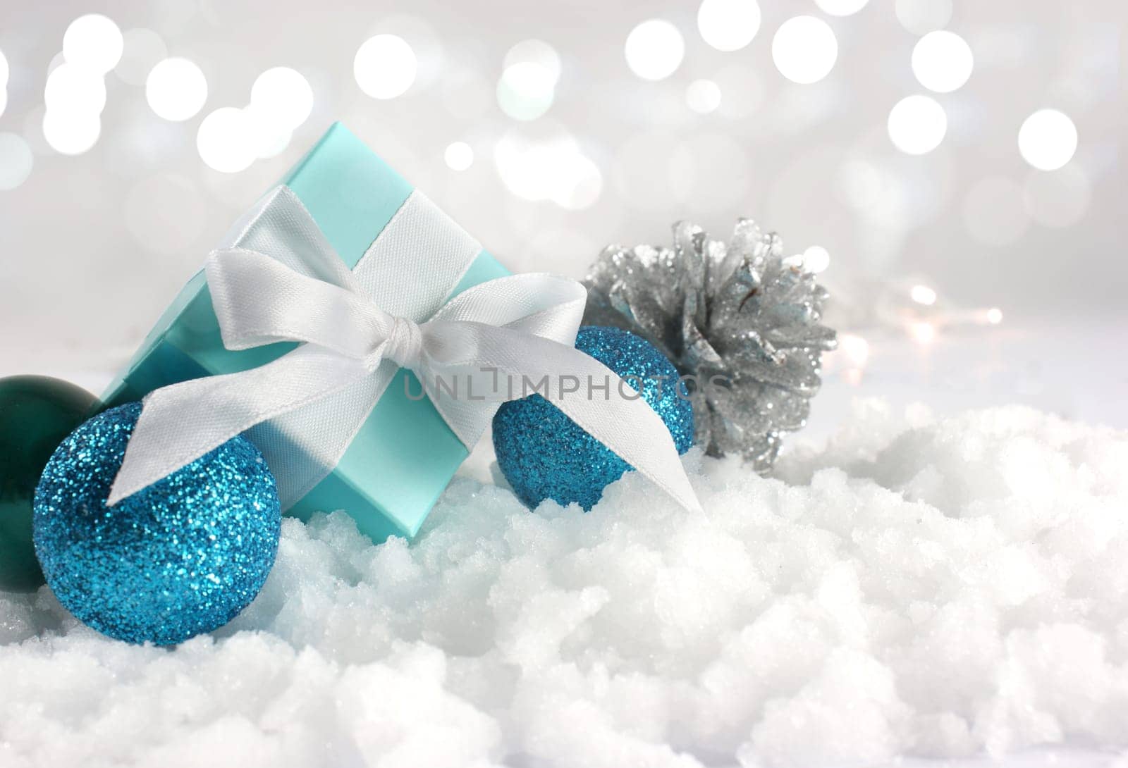Christmas gift and decorations nestled in snow
