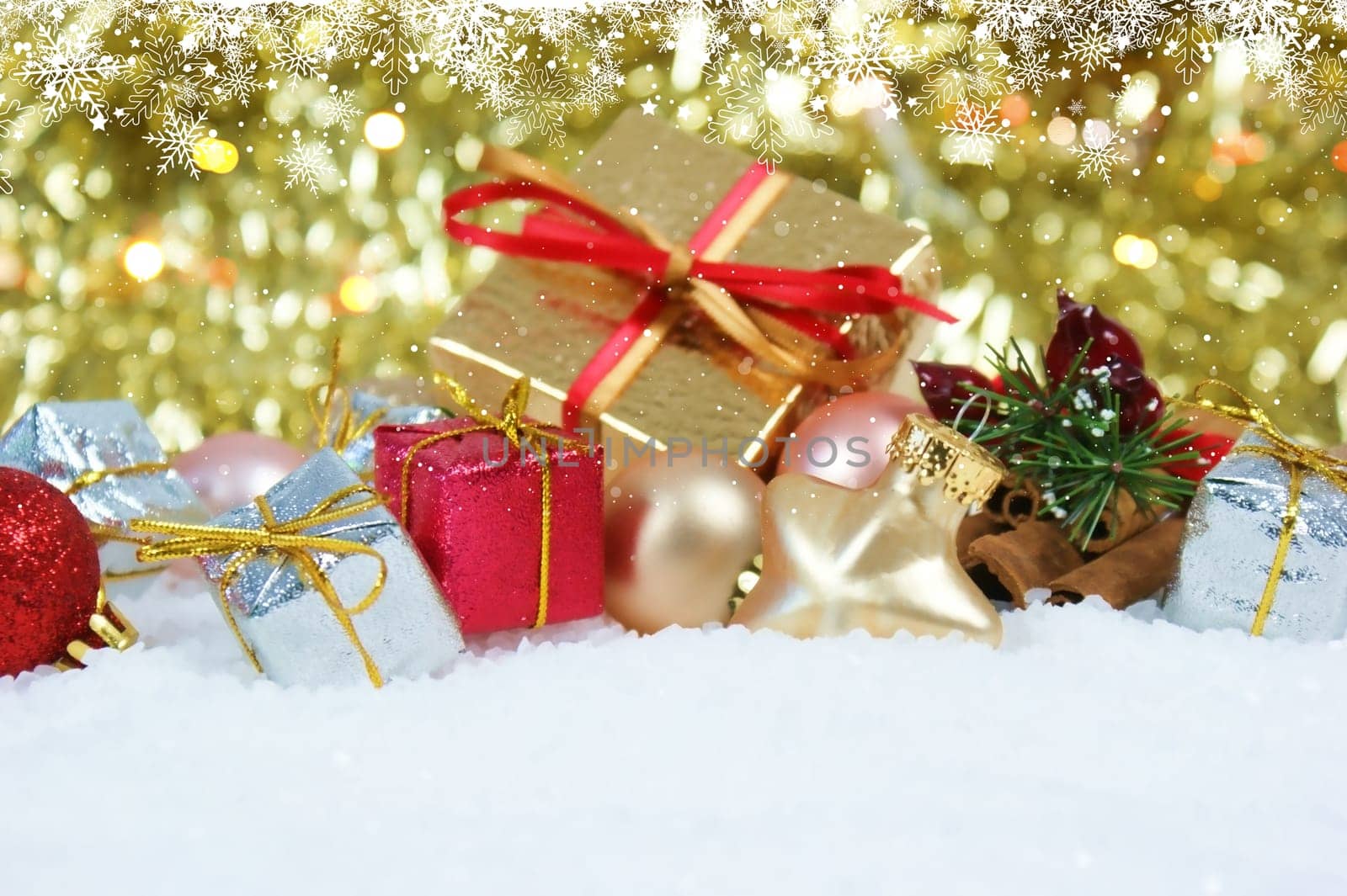 Christmas gifts and decorations nestled in snow