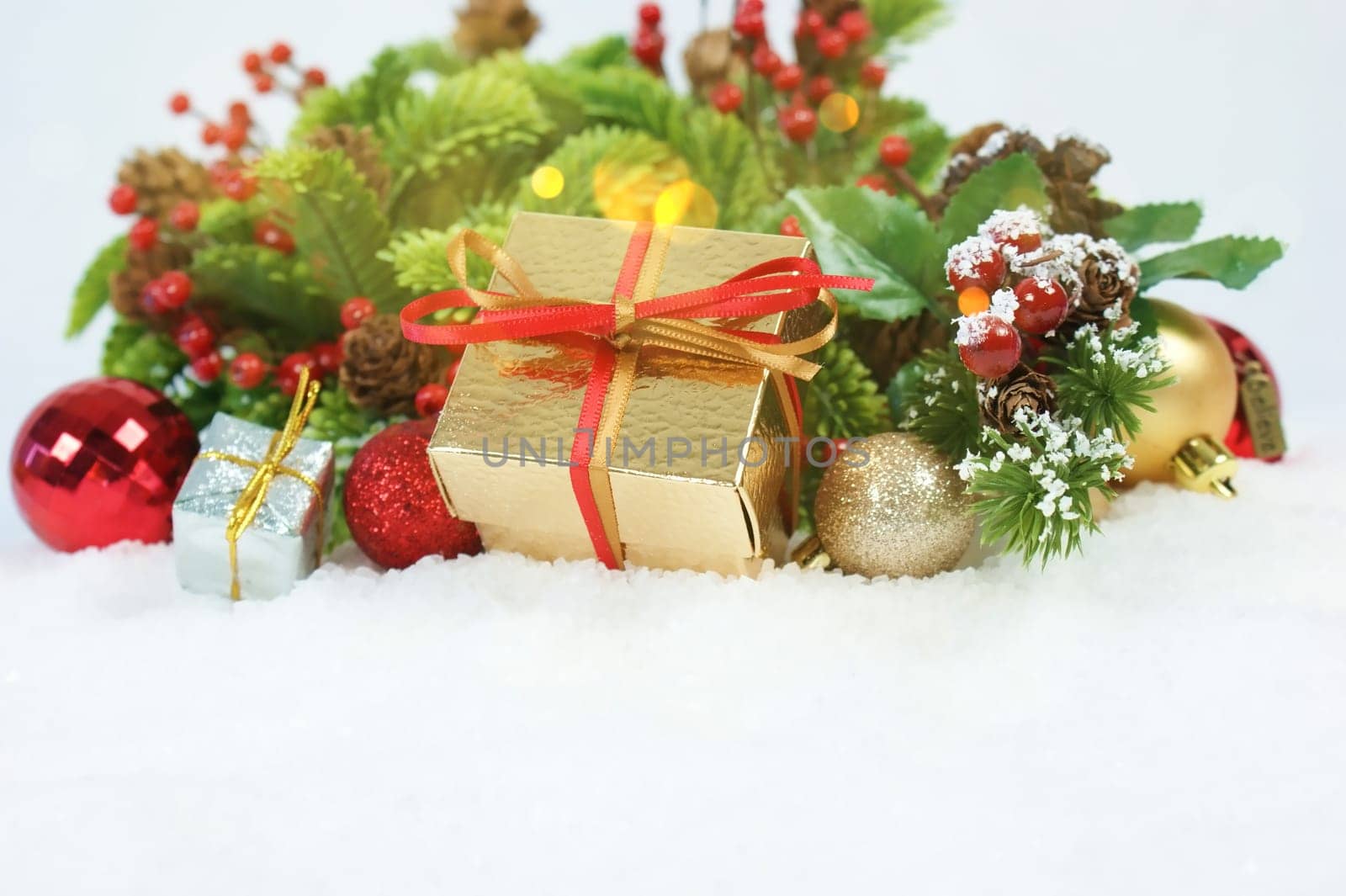 Christmas gift and decorations nestled in snow