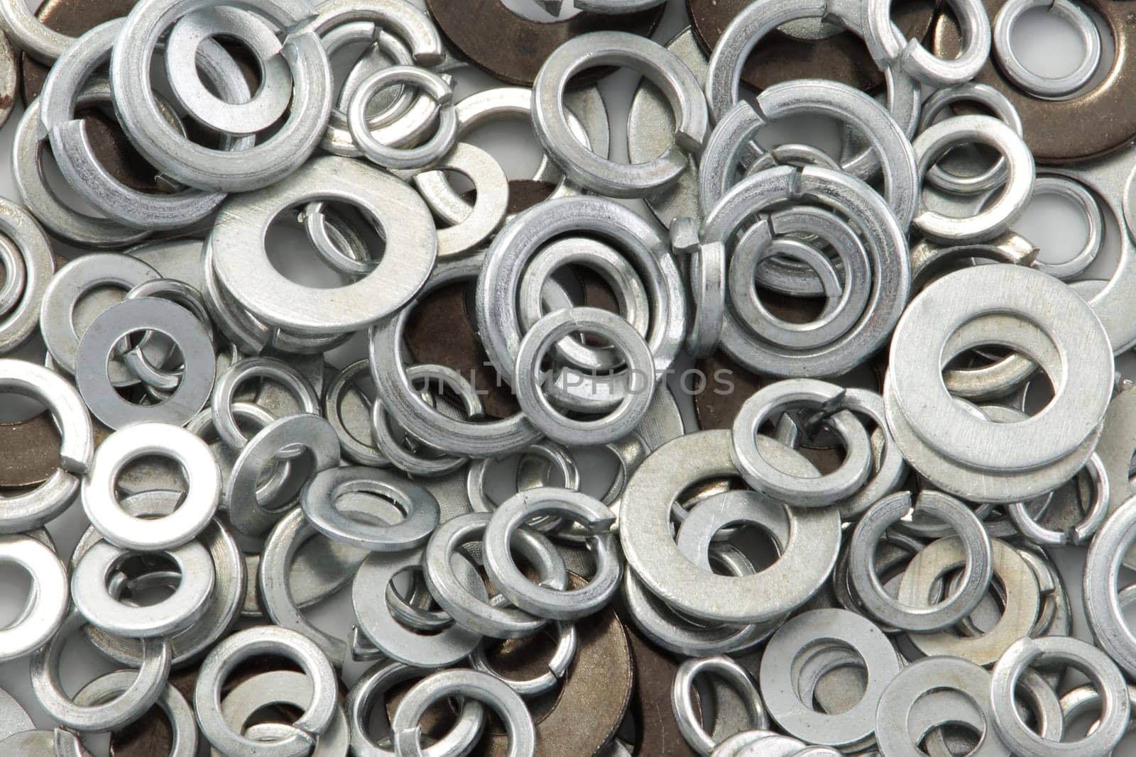 A pile of washers of different sizes background image