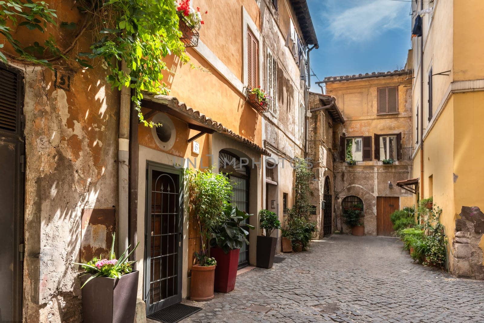 Old street in Trastevere  Rome  Italy. Trastevere is the city of Rome on the west bank of the Tiber in Rome  Lazio  Italy. Architecture and historic site of Rome