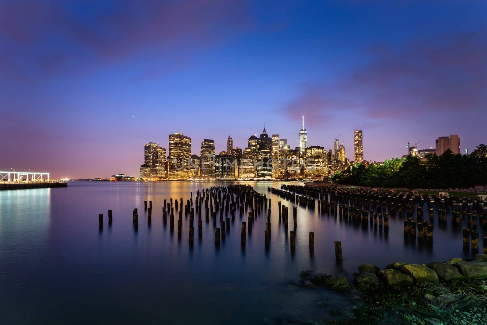 New York City skyline with urban skyscrapers at sunset, USA.