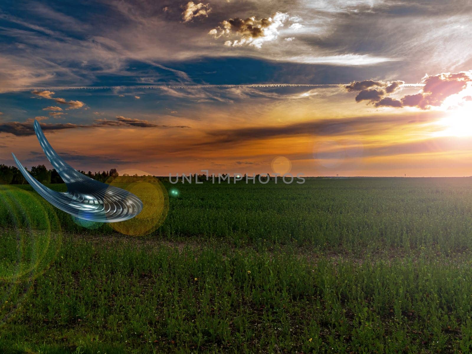 UFO landing over an agricultural field in the rays of a sunset. Unidentified flying object. Flying spacecraft. Alien invasion. Alien civilization. Space technologies. Flying saucer.