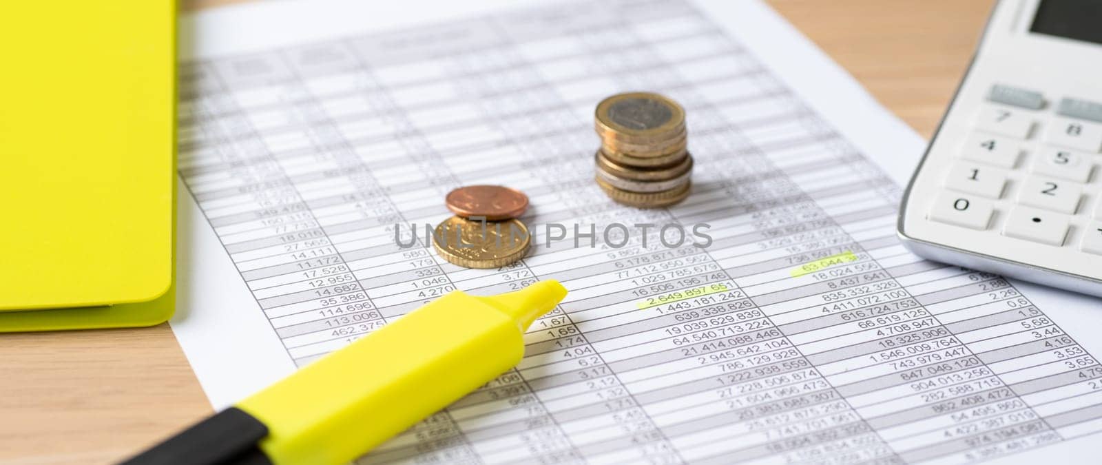 Coins on documents with a calculator