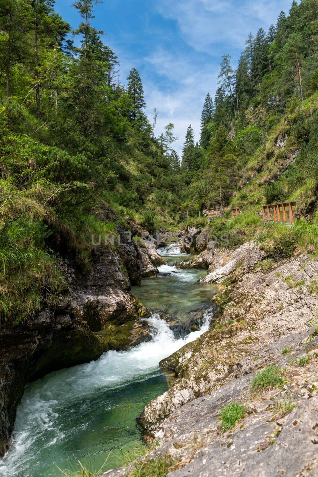 Waterfalls in the Weissbachschlucht in Chiemgau Bavaria with mountains and forest