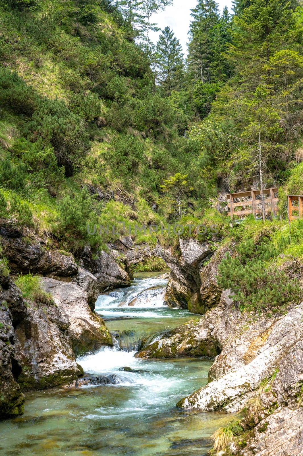 Waterfalls in the Weissbachschlucht in Chiemgau Bavaria with mountains and forest