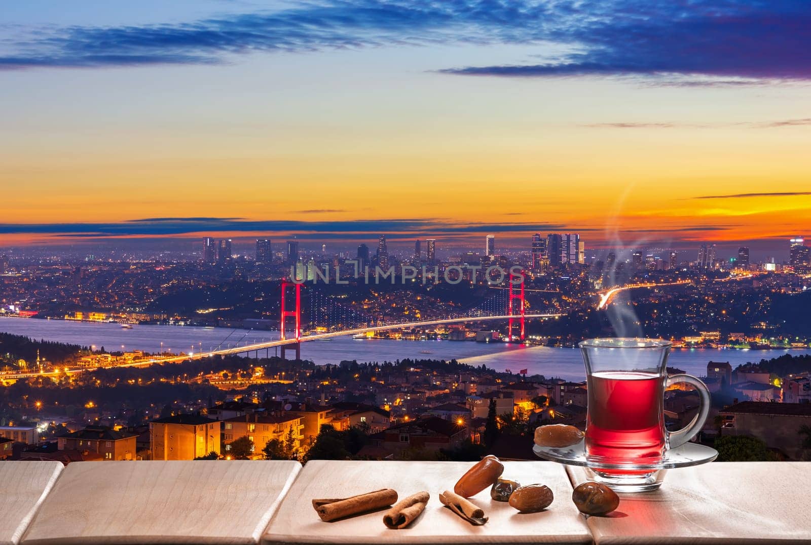 Turkish tea party and The Bosphorus bridge at night, Istanbul.