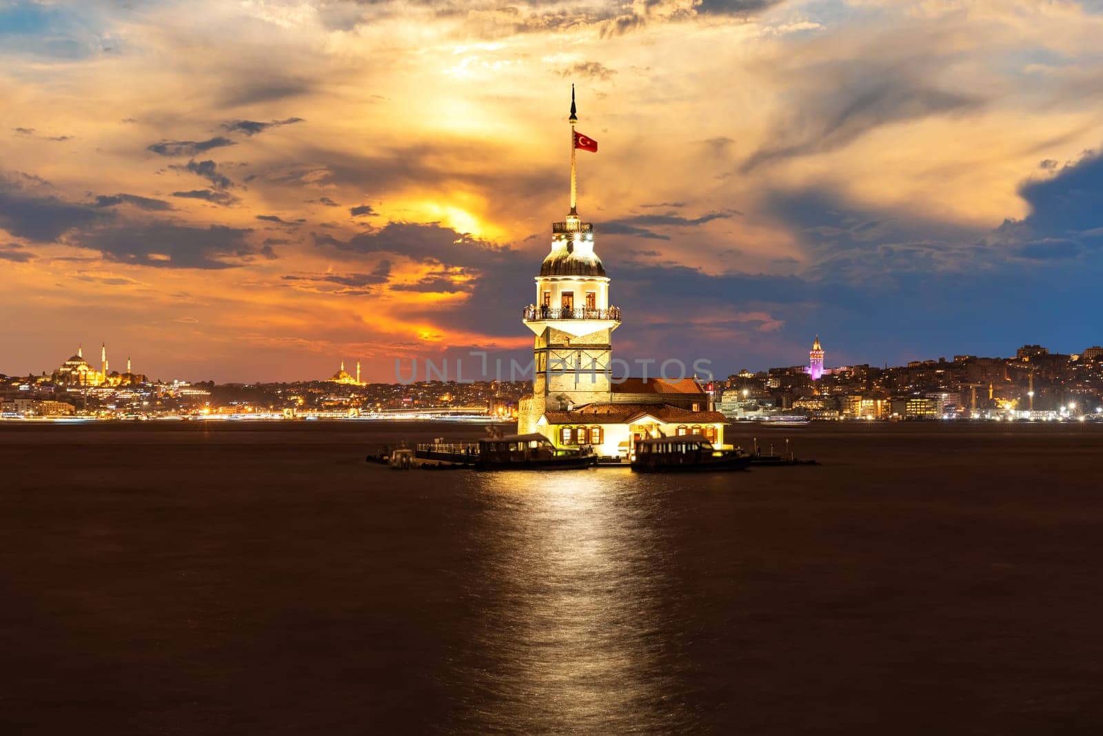 Illuminated Maiden's Tower at night in the Bosphorus, Istanbul.