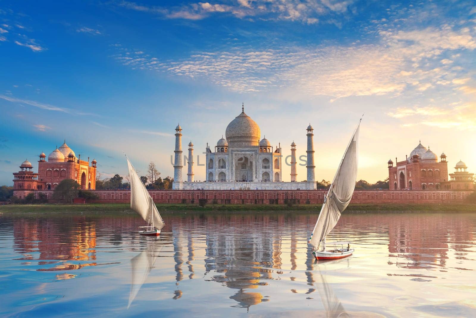 Taj Mahal and sailboats in the Yamuna, Agra, Uttar-Pradesh, India.