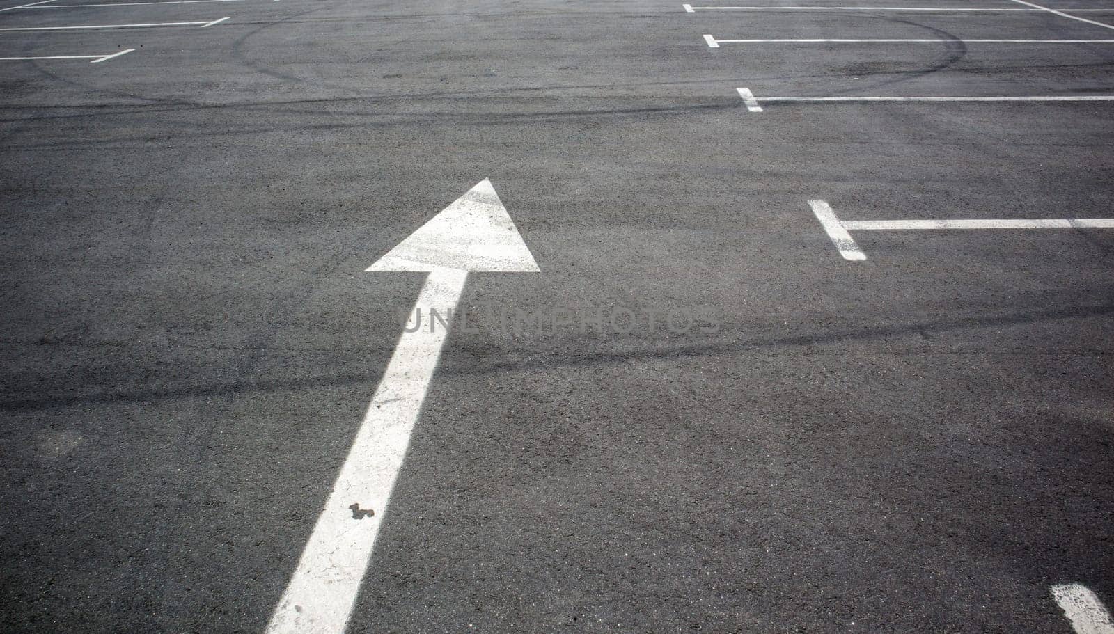 Parking kiosks in the parking lot, marked with white lines. Empty parking lot. Outdoor car park with freshly painted kiosk lines. Outdoor parking on an asphalt road