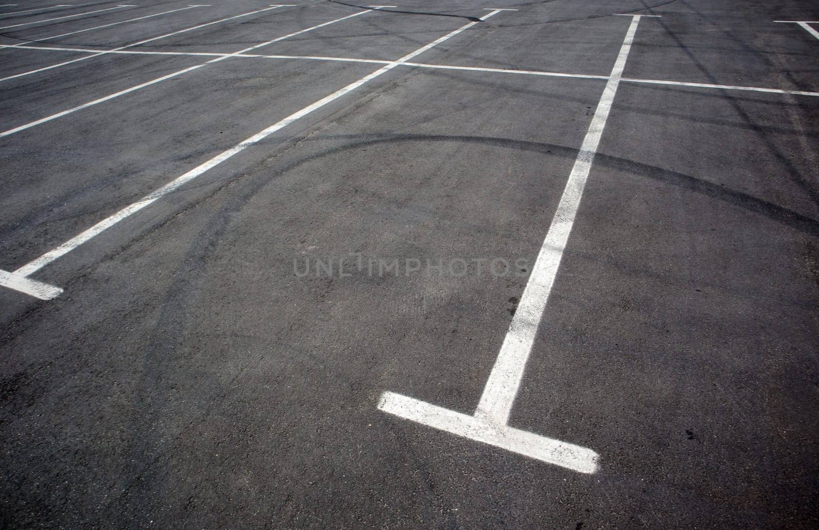 Parking kiosks in the parking lot, marked with white lines. Empty parking lot. Outdoor car park with freshly painted kiosk lines. Outdoor parking on an asphalt road