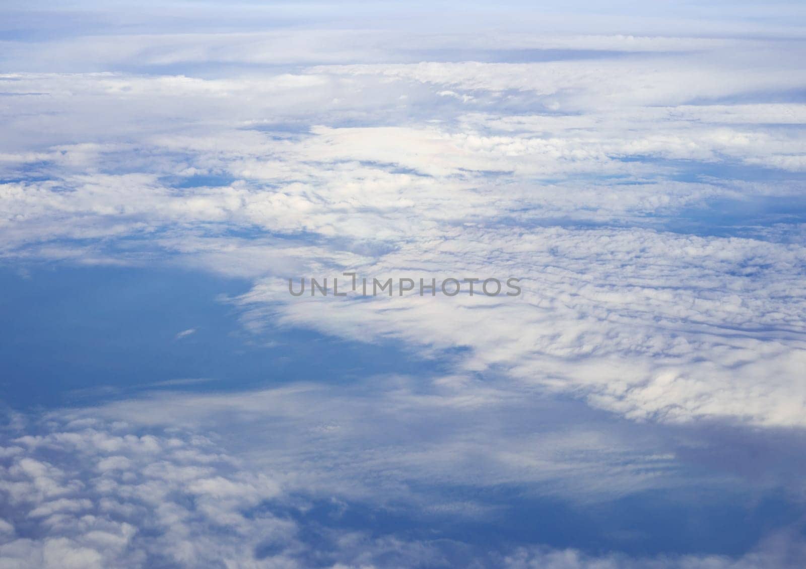 Blue sky and clouds view from airplane window