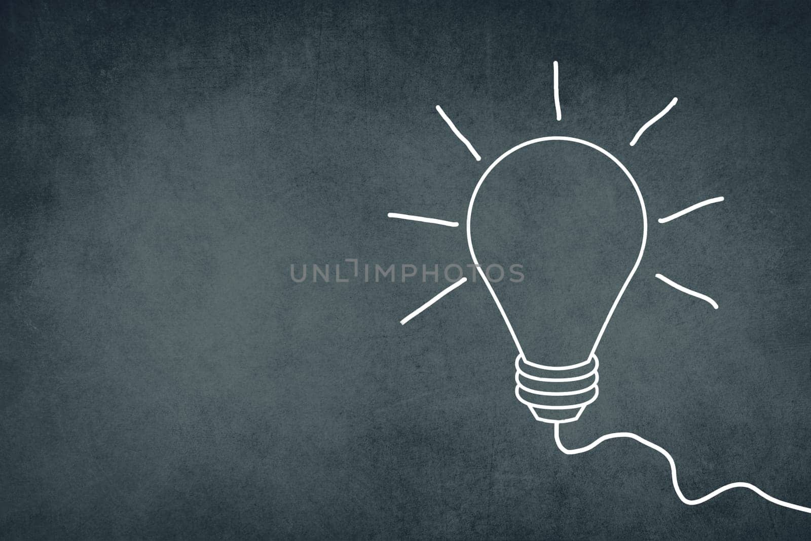 A white bulb on a dark brown textured background, symbol for idea, creativity, business, planing