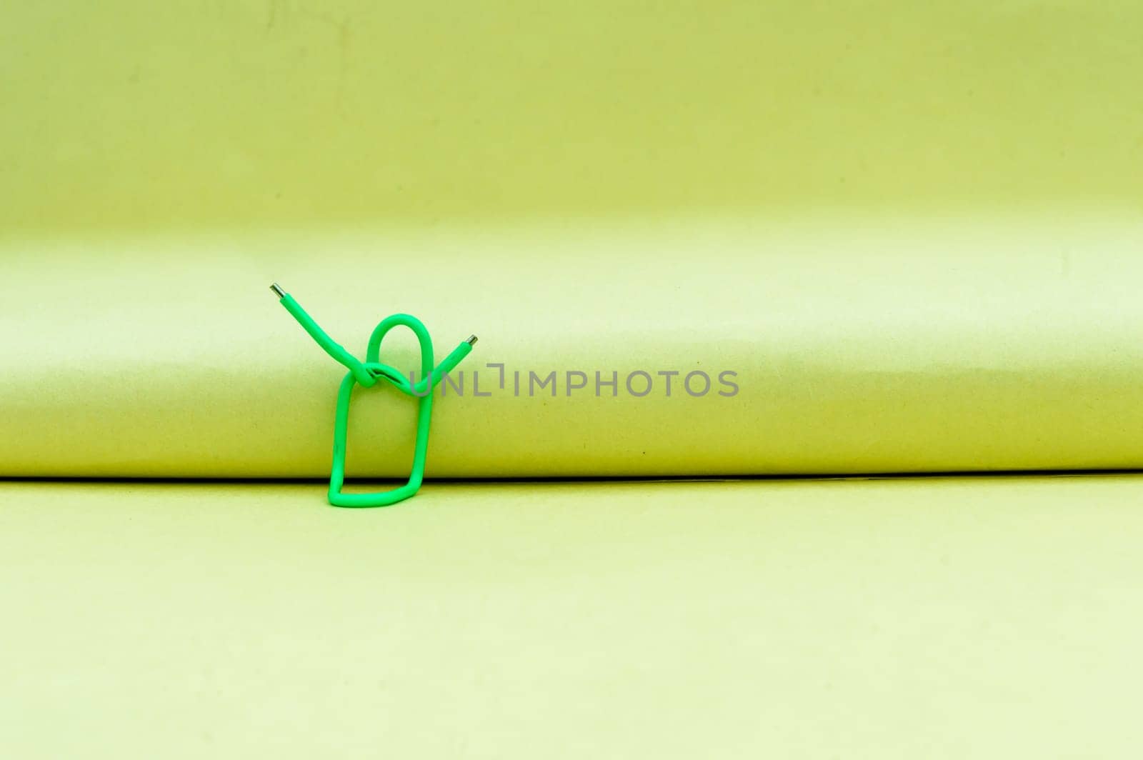 Hands in the air. Abstract Human Figure of Paper Clip. Creative Photography. Still life. Copy Space