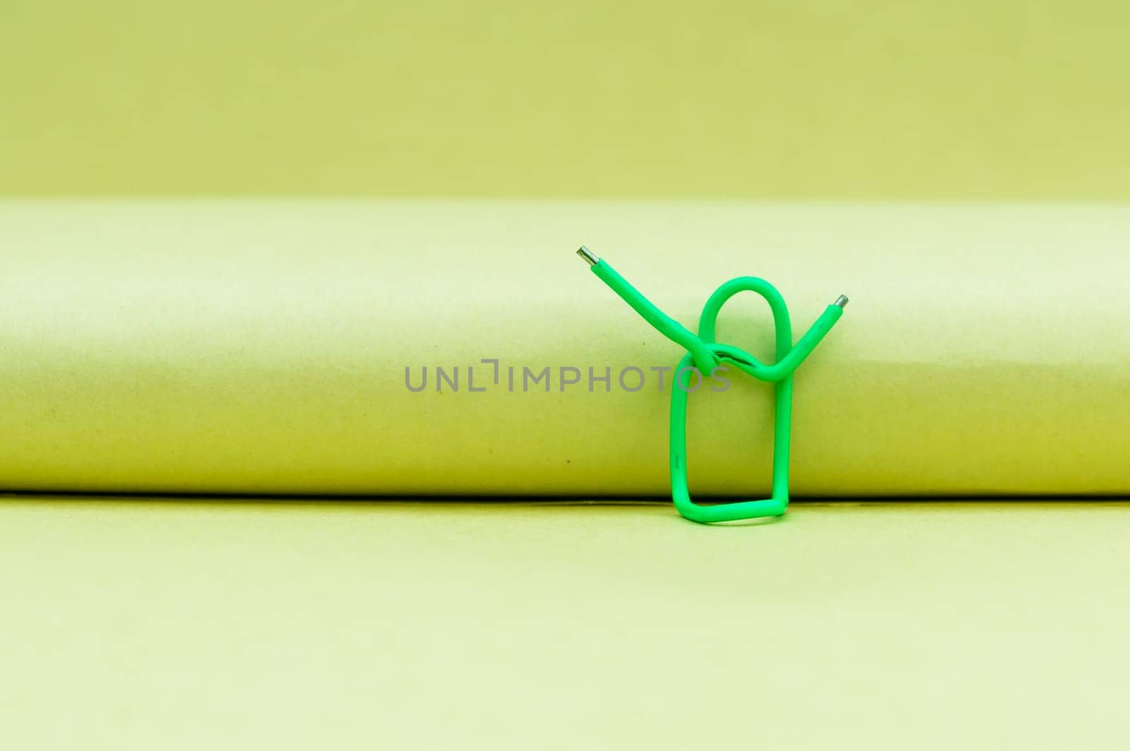 Hands in the air. Abstract Human Figure of Paper Clip. Creative Photography. Still life. Copy Space