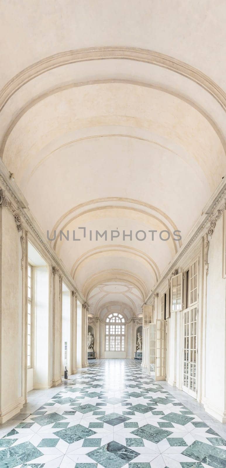 VENARIA REALE, ITALY - CIRCA MAY 2021: corridor with floor made of luxury marbles. Plenty of elegance for this Italian interior in Venaria Reale, Piedmont region.