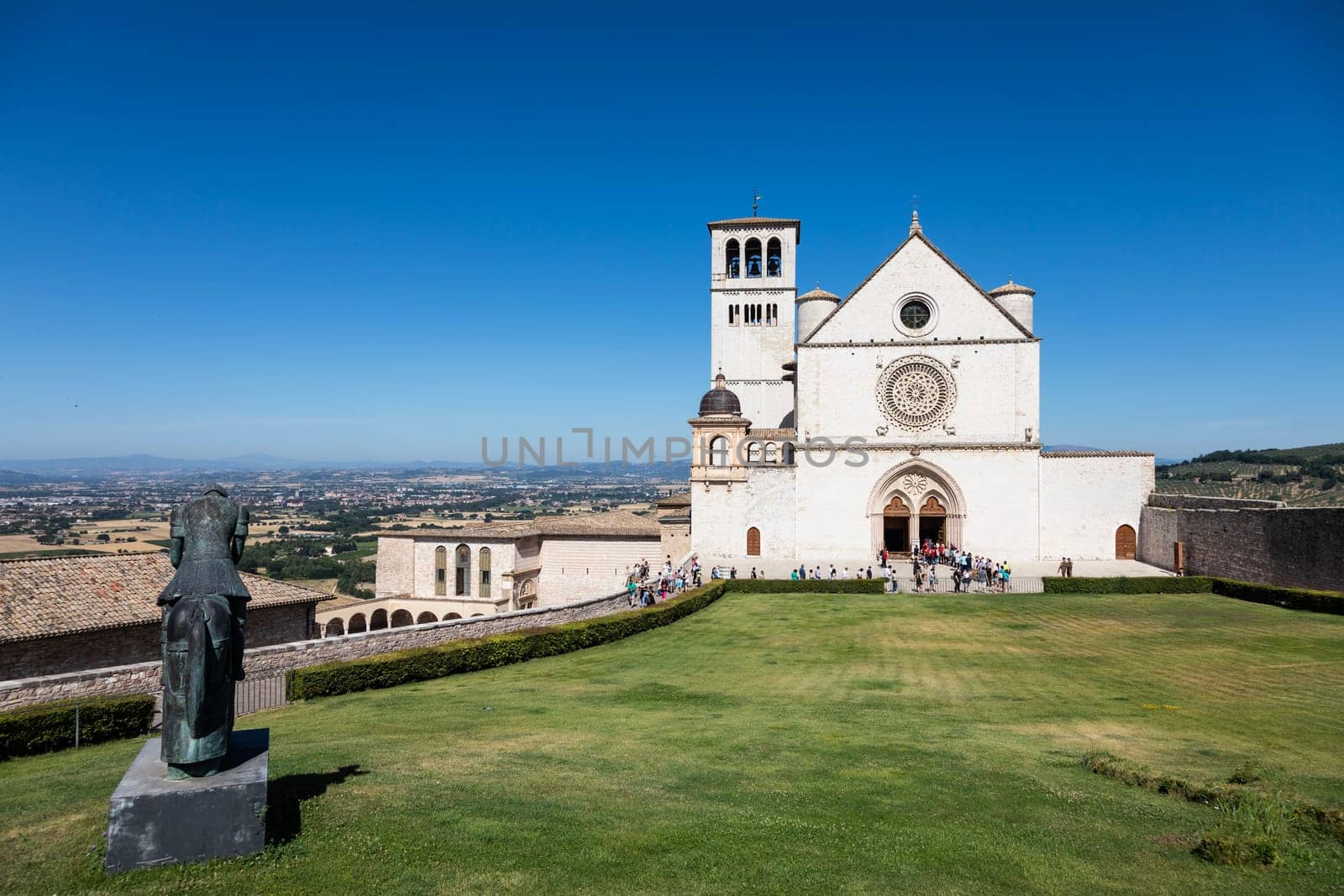 Assisi village in Umbria region, Italy - circa June 2021: the most important Italian St. Francis Basilica (Basilica di San Francesco)