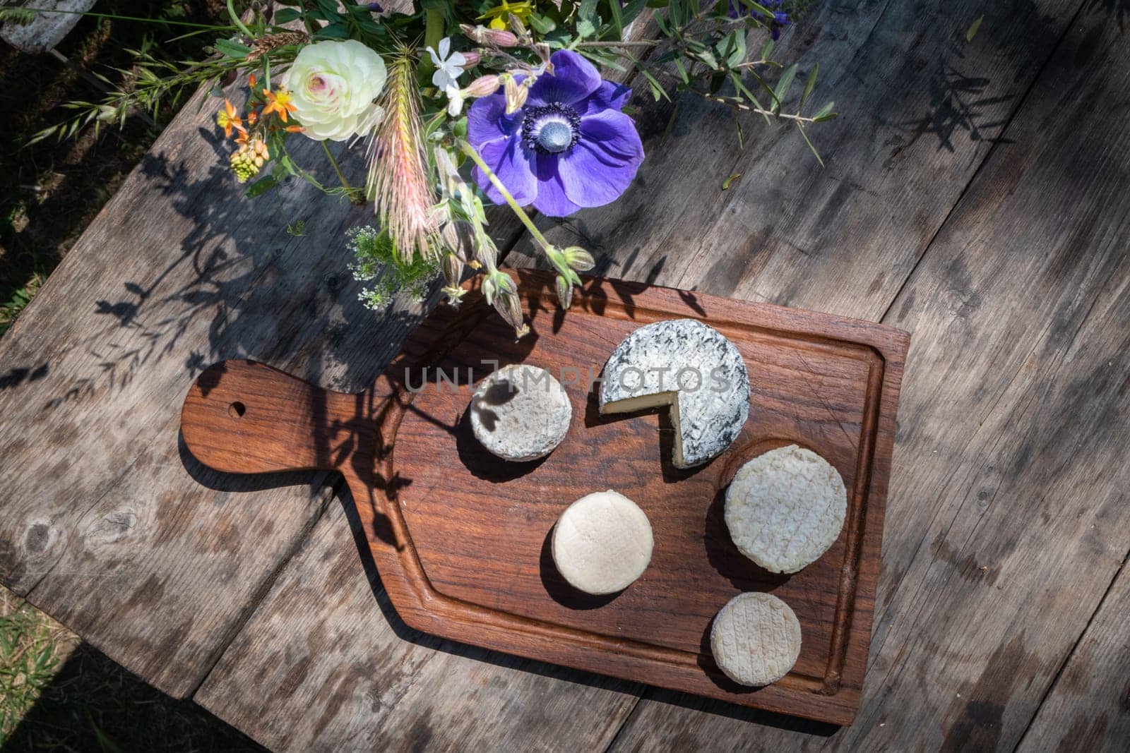 Cheese plate on a wooden table in the south of France