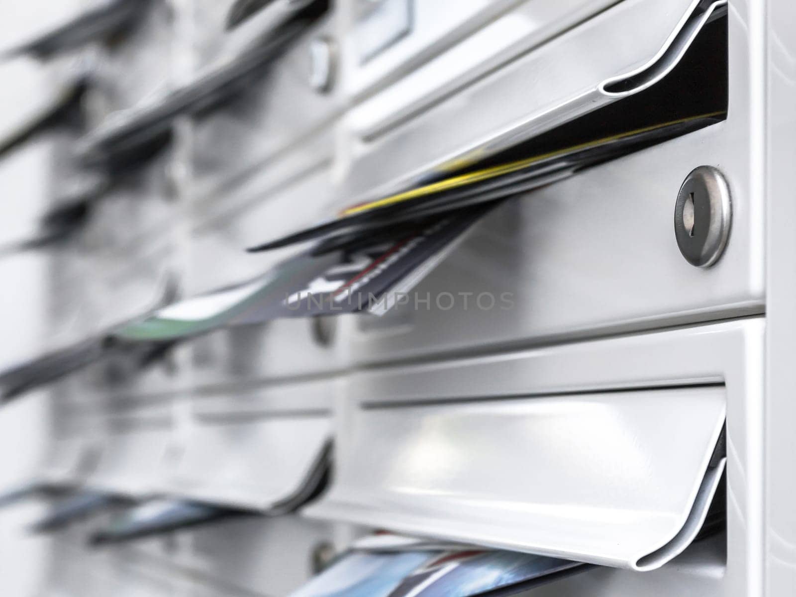 New mailboxes filled of leaflets. Business and advertising concepts. Shallow dof.