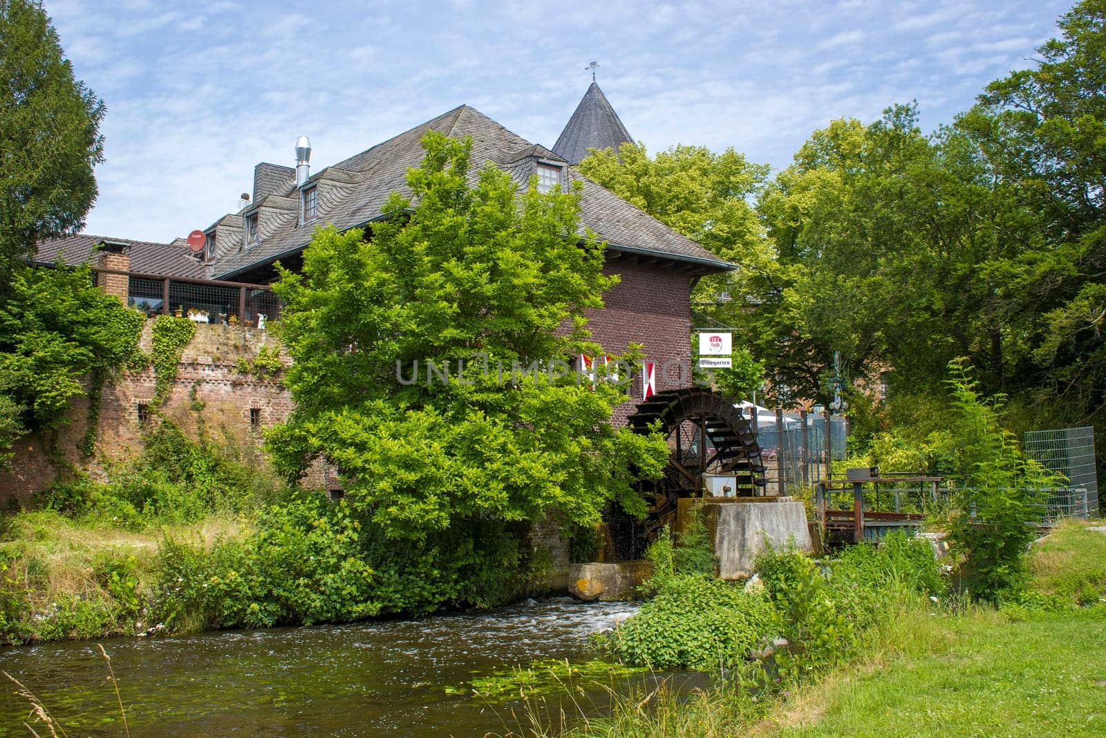 Viersen-Brueggen - June 27, 2021  View to water mill, North Rhine Westphalia, Germany