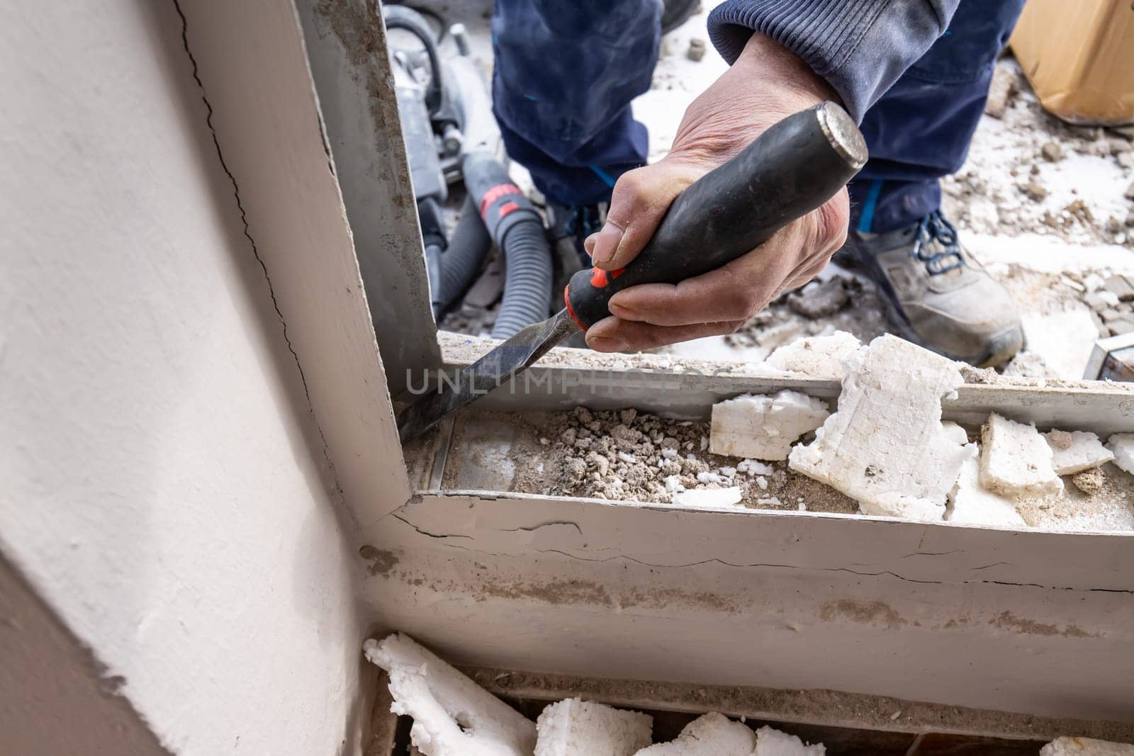 Remnants of cement from removing a house door with a chisel
