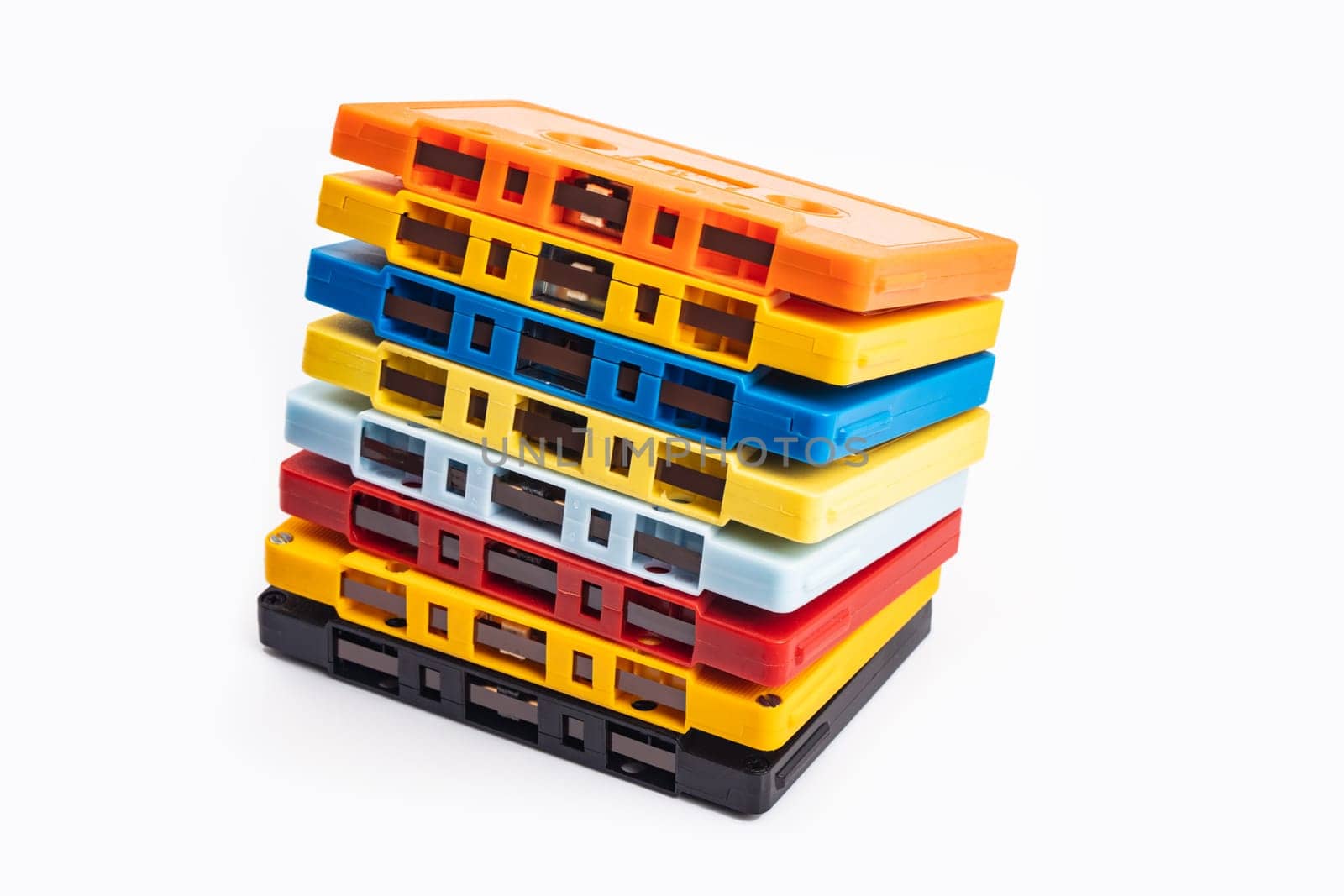 Collection of colorful audio tapes on white background