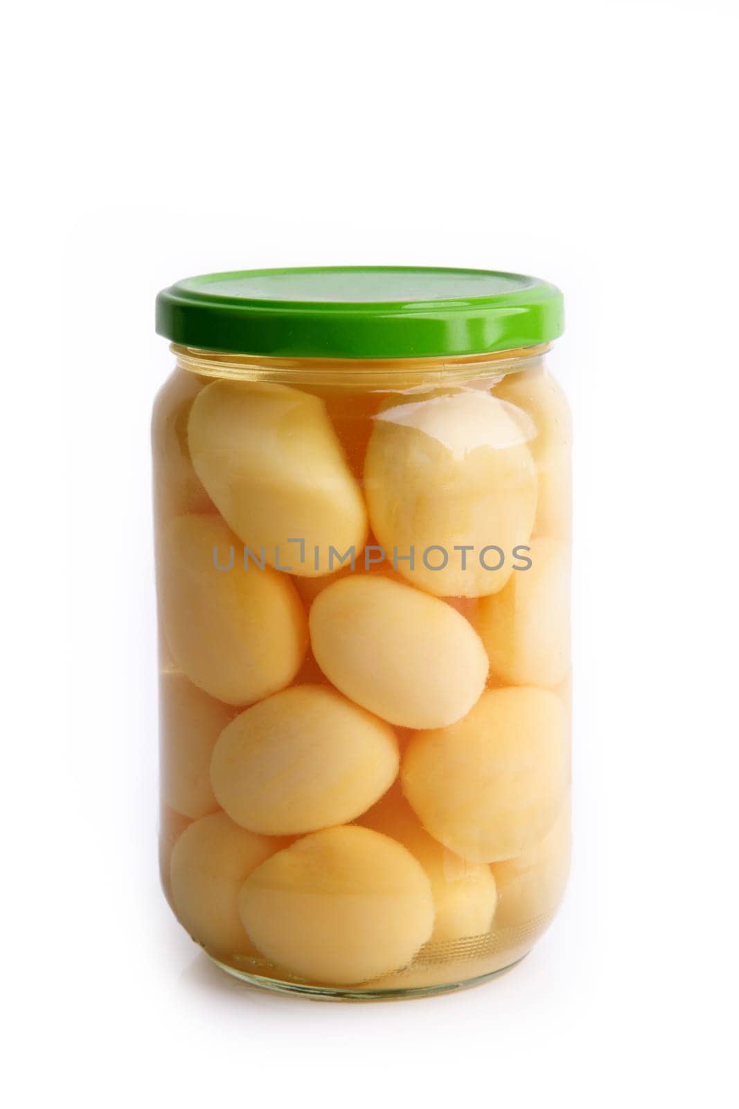 Boiled potatoes in a glass isolated on white background
