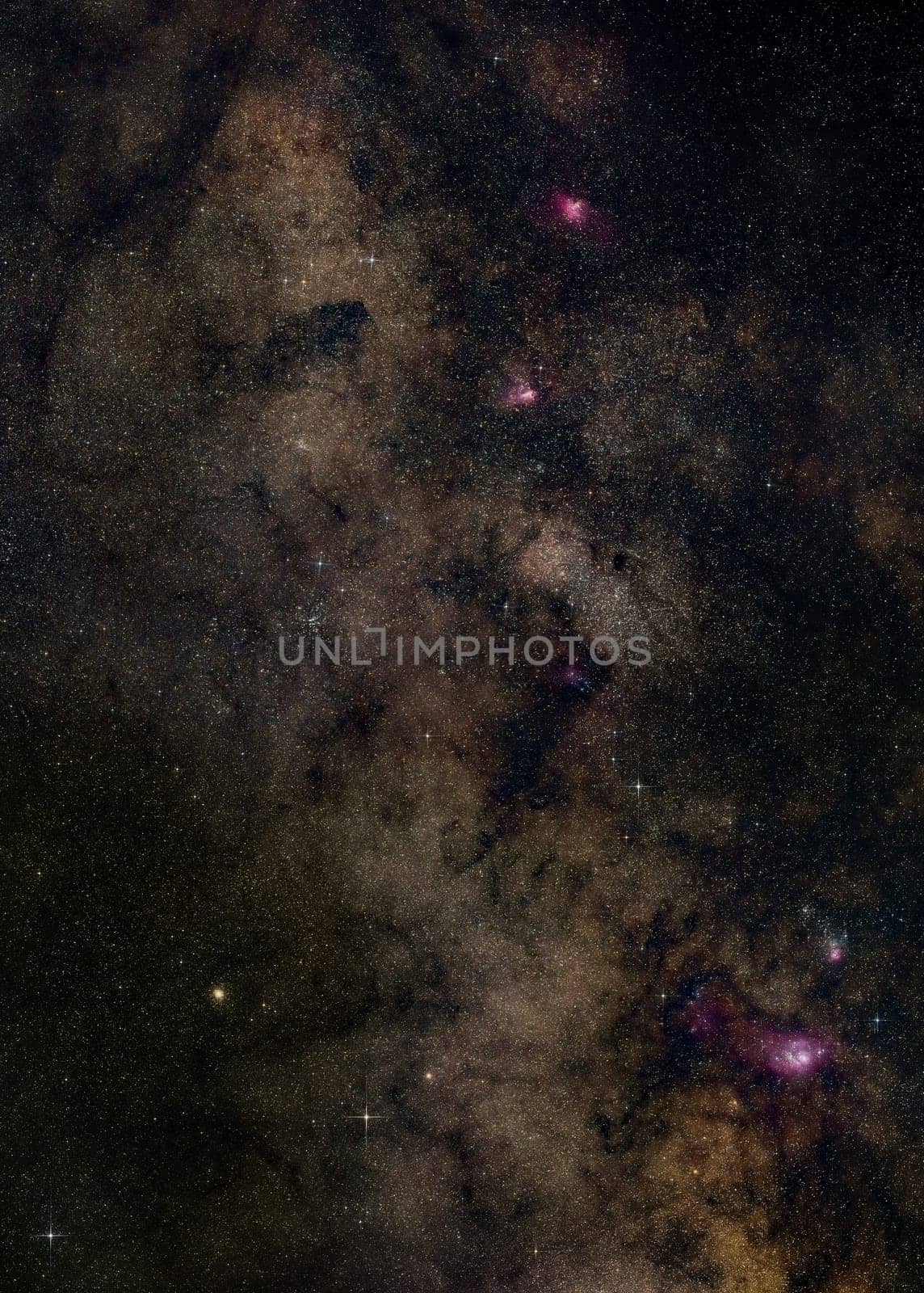 Night sky with milky way near Sagittarius constellation, bright Kaus Borealis star in lower middle, purple Lagoon, Trifid, Omega and Eagle nebula visible. Long exposure stacked photo.