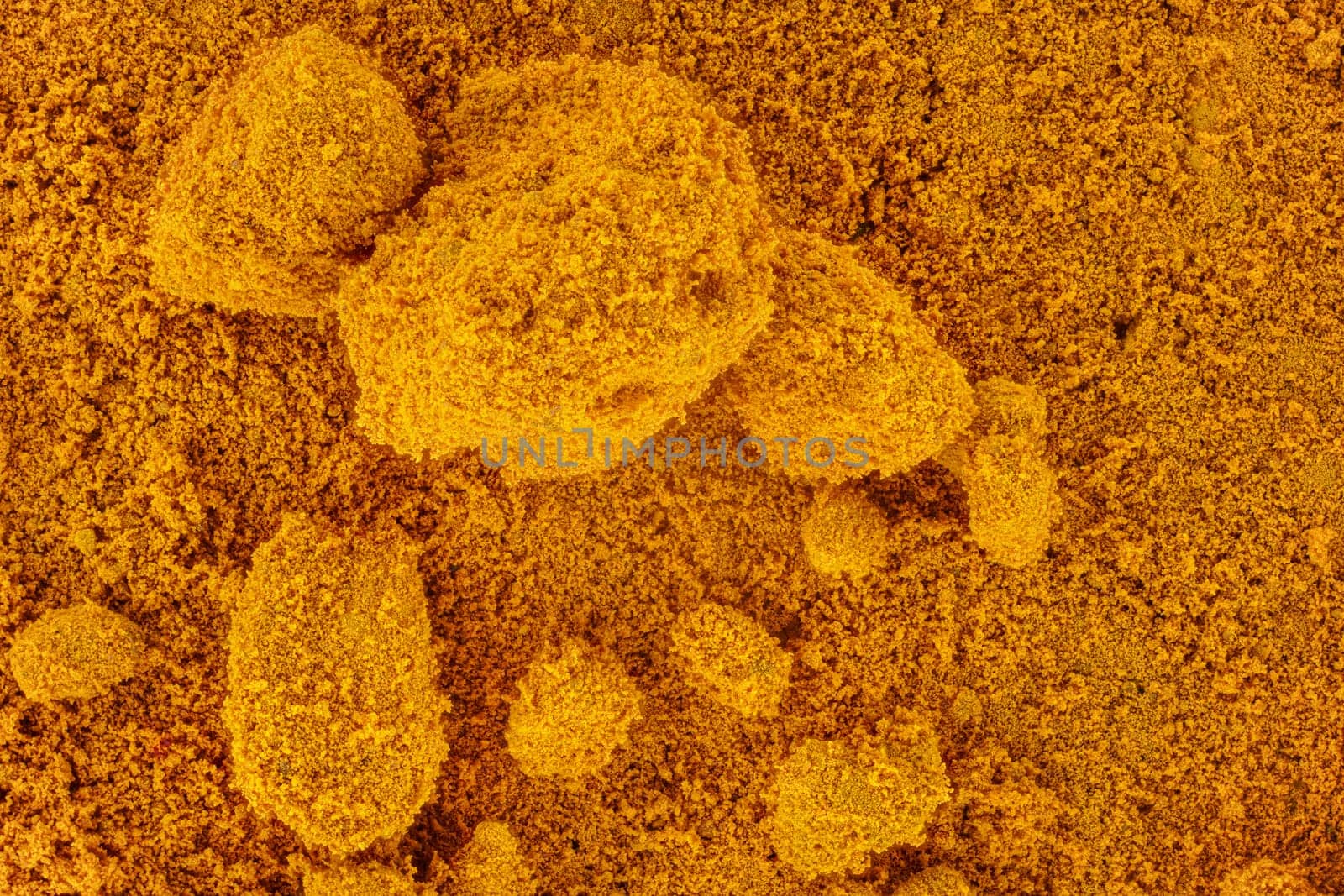 Fine powder - Methyl yellow organic compound - under microscope, image width 9mm. Abstract science background.