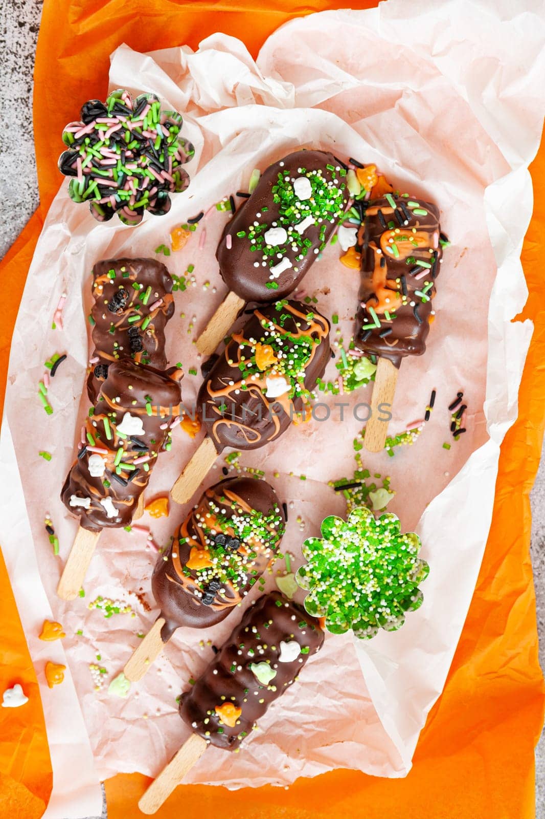 Halloween cake pops, chocolate covered with colorful sugar sprinkles