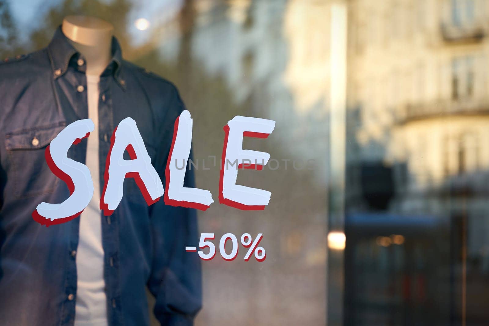Lettering Sale on the window of a store in the center of Berlin