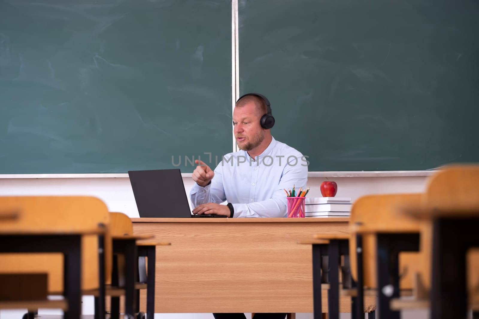 Back to School Concept. School teacher giving virtual teaching remote class online lesson by zoom conference call on laptop computer.