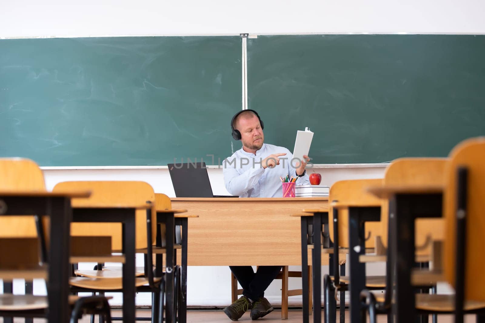 Back to School Concept. School teacher giving virtual teaching remote class online lesson by zoom conference call on laptop computer.